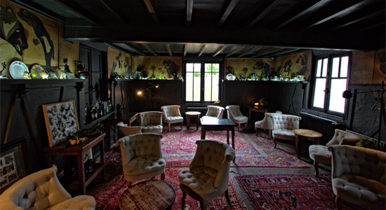 cosy sitting room with wood beams and oak panels at La Grenouillre restaurant northern France